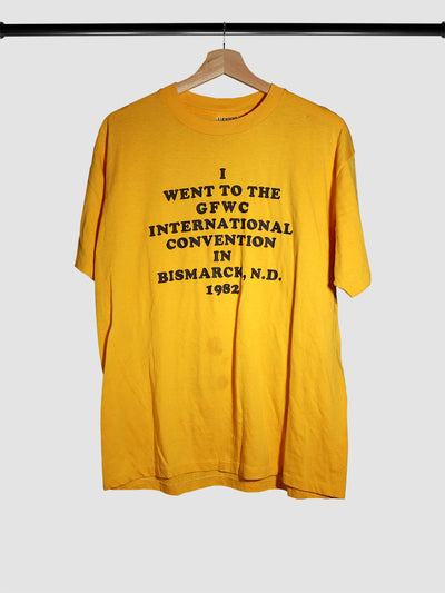Commemorative convention merchandise t-shirt in bright yellow dated 1982.