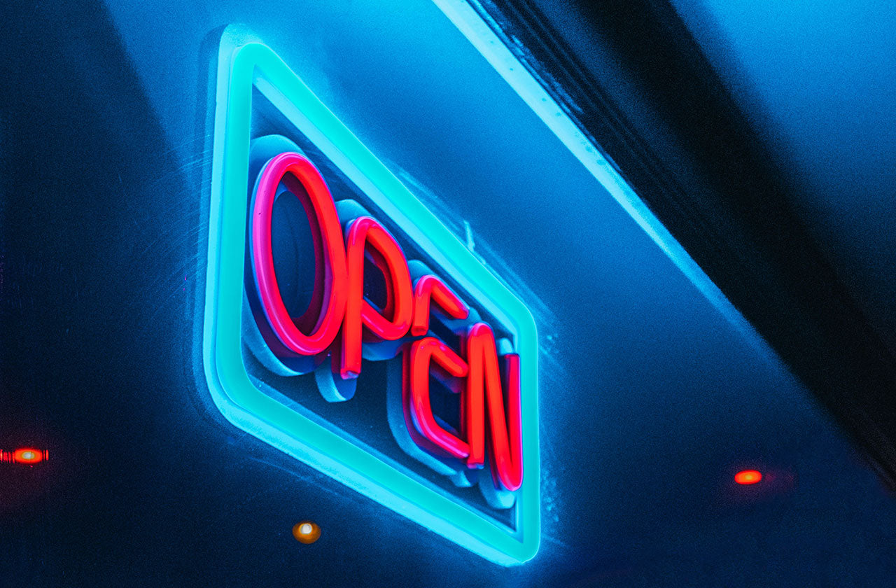 Neon open sign in a store window.