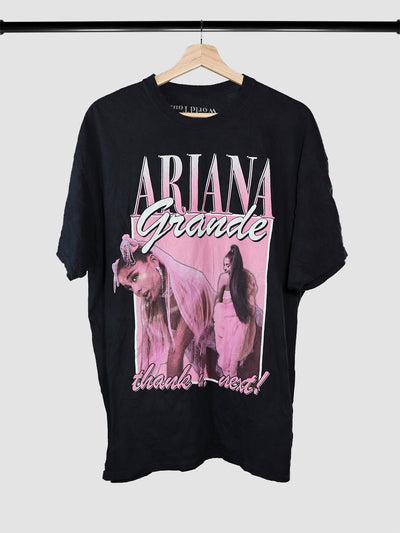 Ariana Grande tour merchandise t-shirt on a hanger.