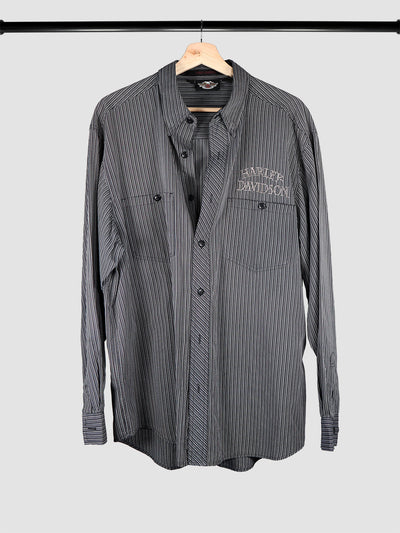 Gray and black striped Harley Davidson button down shirt with embroidered patch on the left chest pocket.
